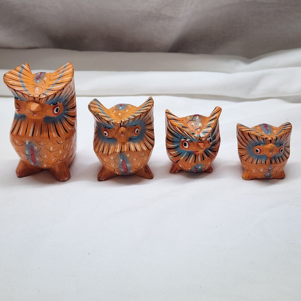 Set of 4 hand painted wooden owls. 1 eye needs repainting